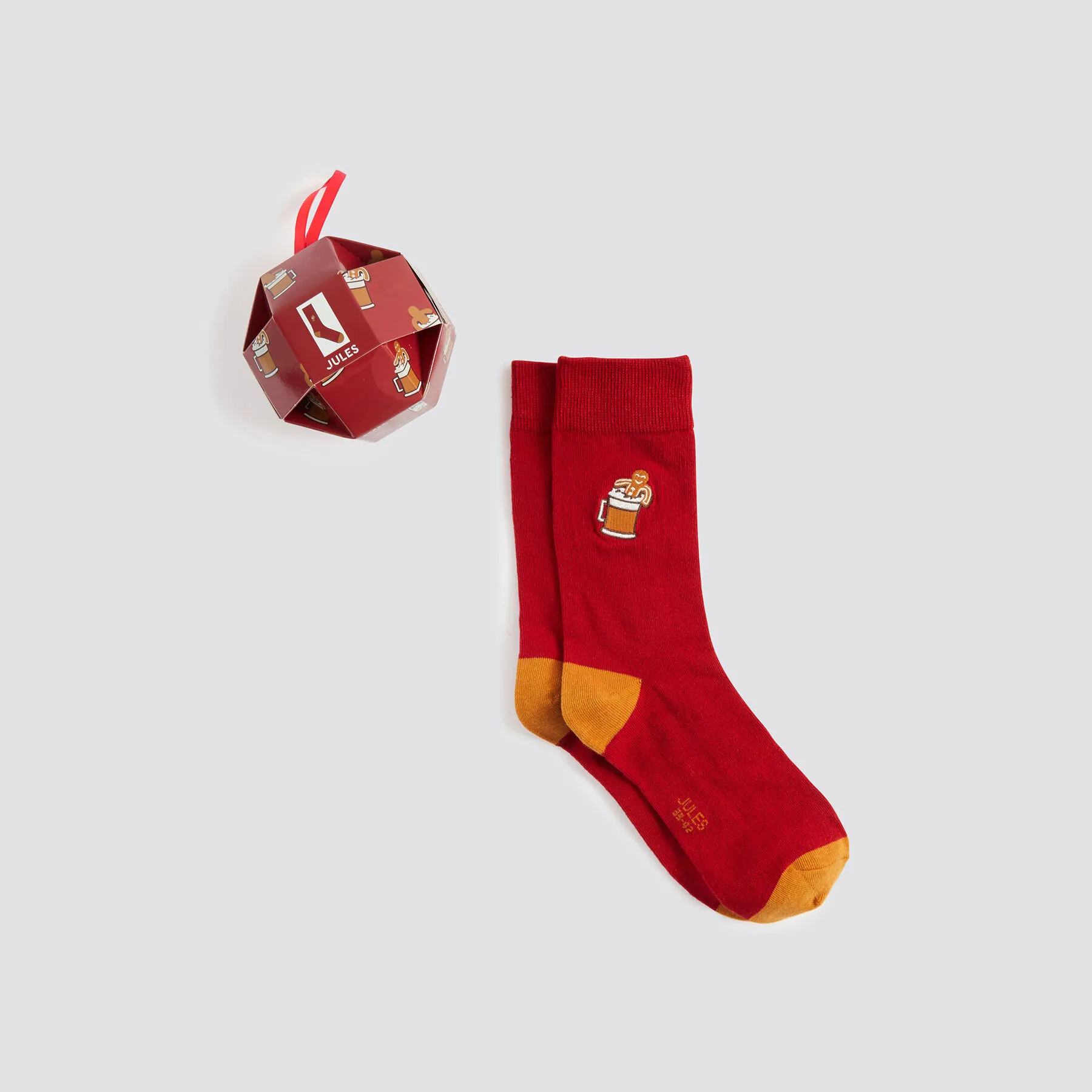 Chaussettes fantaisie dans une boule de Noël Rouge | Jules